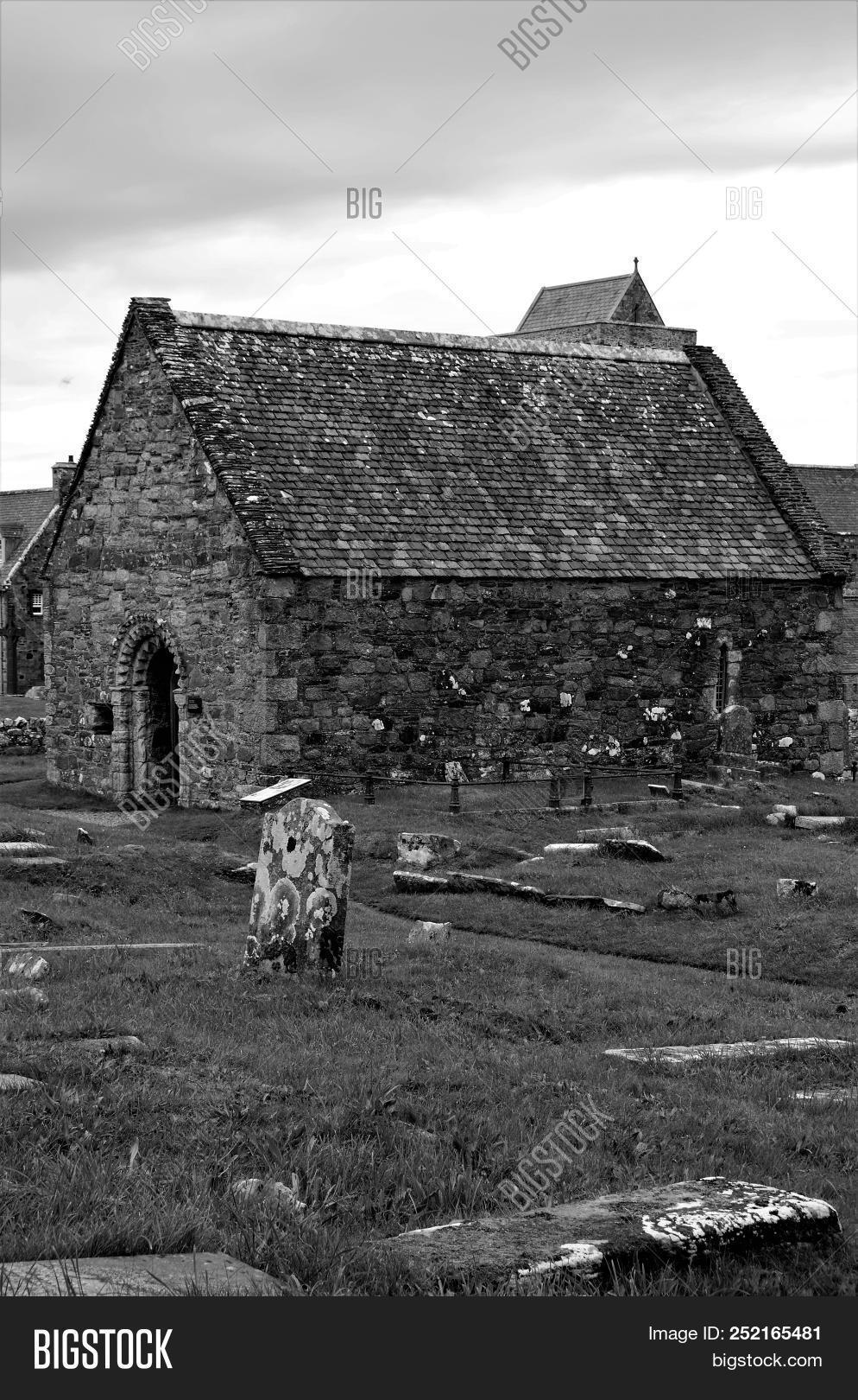 abbey,antiquity,arch,architecture,argyll,building,burial,cemetery,chapel,christianity,exterior,gravestone,graveyard,ground,headstone,heritage,historic,history,iona,island,landmark,medieval,old,oran’s,outdoors,relic,religion,ruin,scotland,st.,stone,tombstone,uk