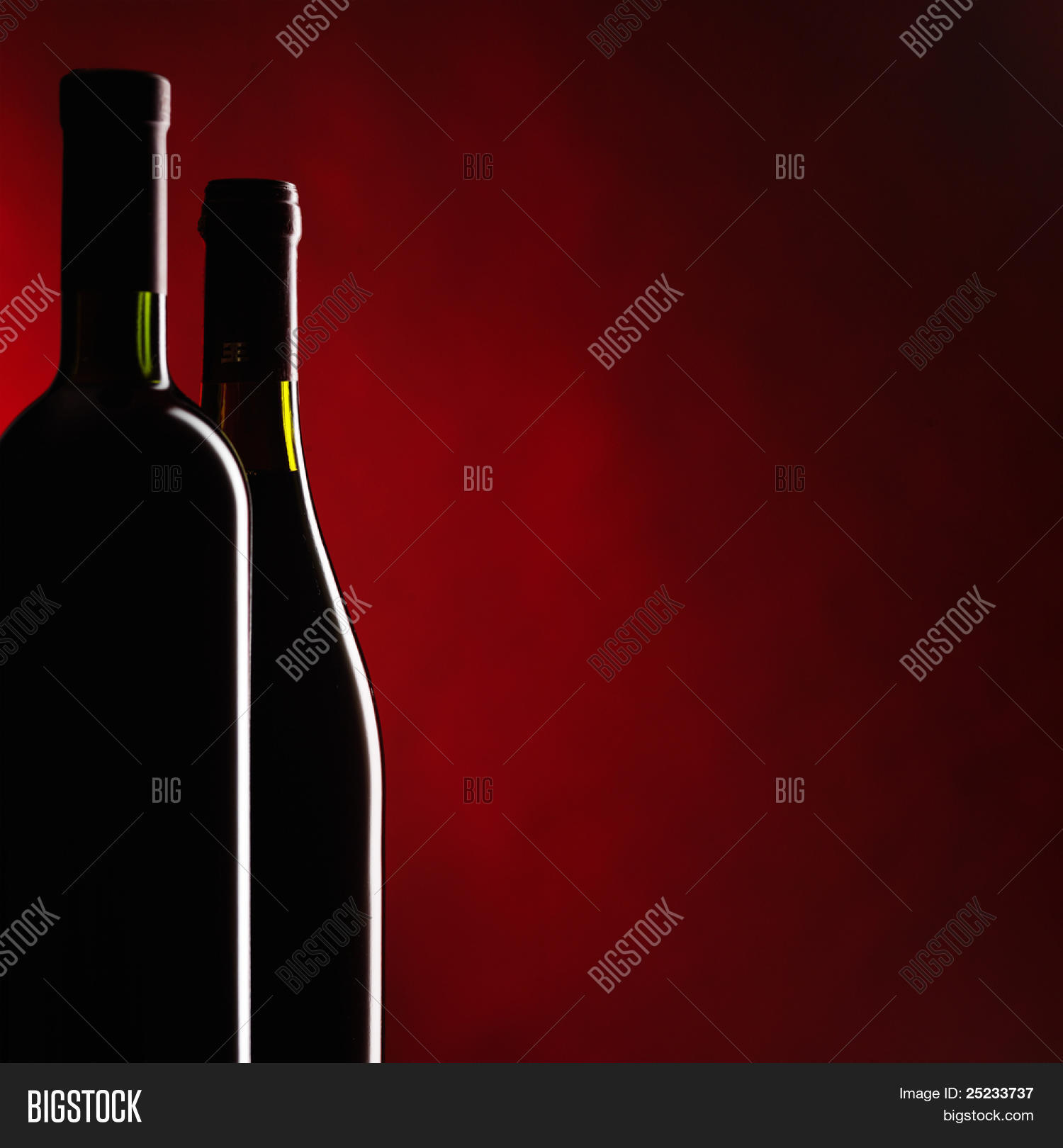 Bottle And Glass Of Red Wine On Dark Red Background 25233737 Image Stock Photo