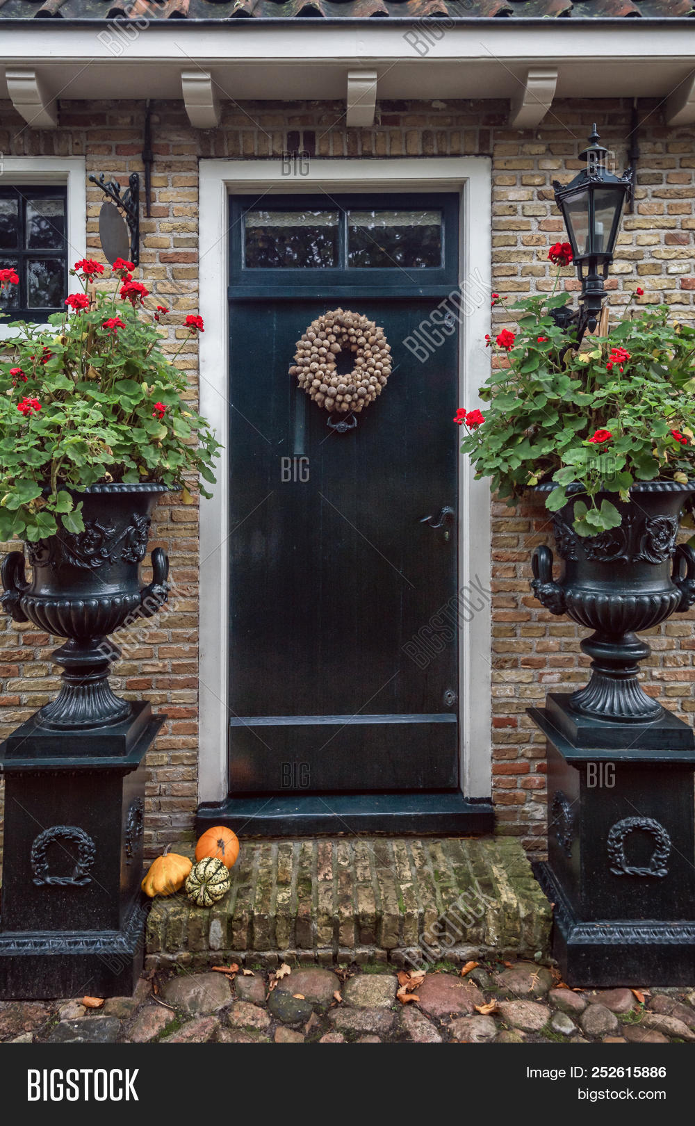 Architecture,autumn,bastion,colorful,colors,construction,day,decorated,decoration,design,door,doorstep,entrance,facade,flowers,fortification,fortified,garden,geraniums,glass,green,growing,halloween,history,ideas,idyllic,leaves,nature,netherlands,old,pedestal,picturesque,planter,plants,pumpkins,red,step,stones,street,vases,view,village,wall,window,wreath