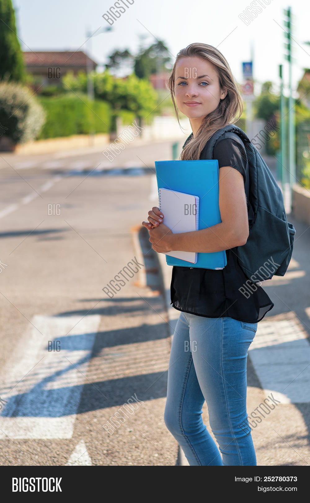 academic,back,background,backpack,bag,books,building,campus,caucasian,class,college,day,education,female,girl,go,going,hair,happy,high,knowledge,learn,learning,life,one,outdoors,people,person,portrait,school,schoolgirl,semester,smiling,standing,student,study,teen,teenager,textbook,to,university,urban,walk,walking,woman,year,young,youth