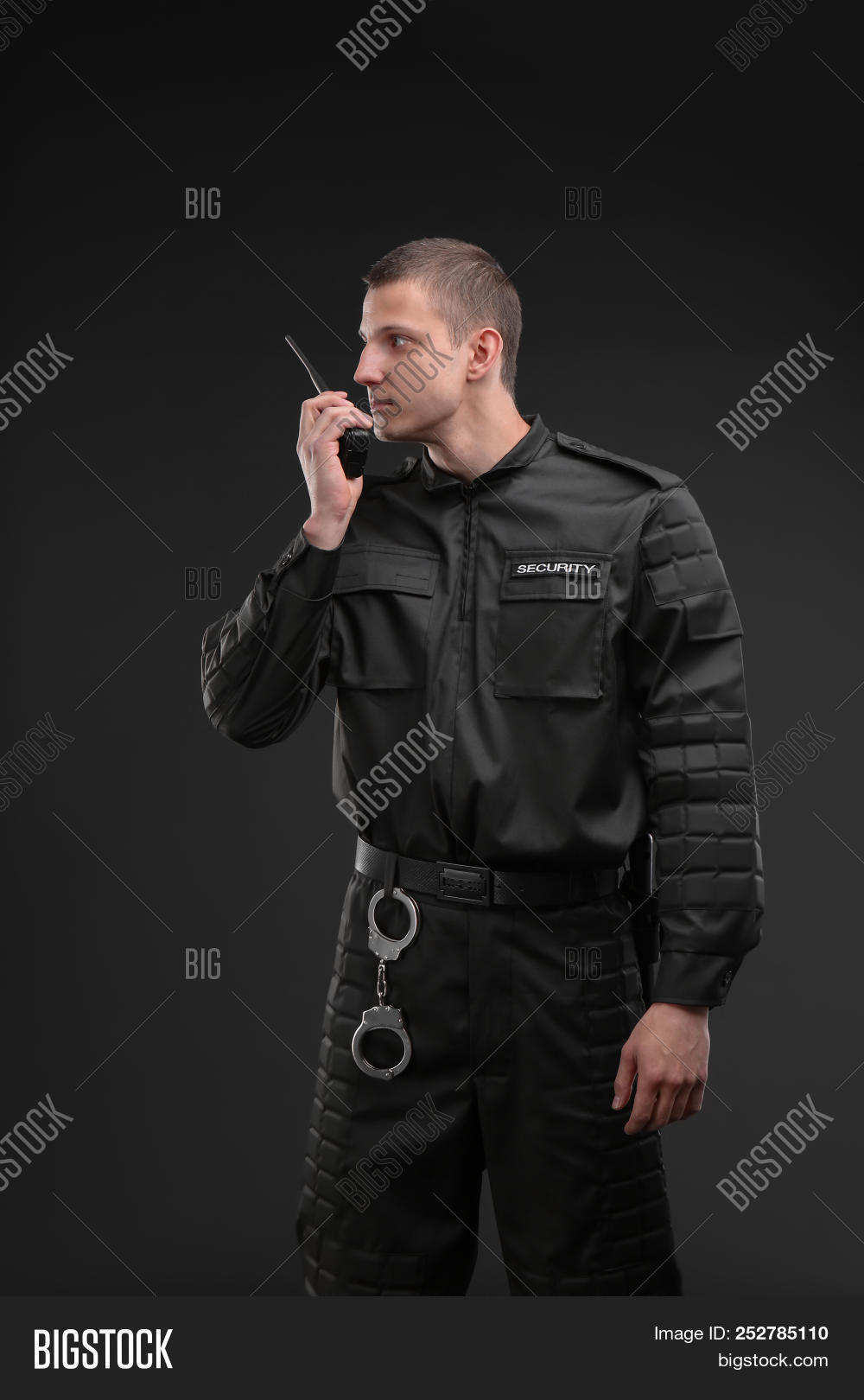 adult,agency,authority,background,black,bodyguard,business,caucasian,connection,dark,defence,device,duty,employee,escort,guard,handcuffs,job,male,man,occupation,one,patrol,person,police,portable,portrait,private,professional,protect,protection,protector,radio,safeguard,safety,security,service,speaking,staff,transmitter,uniform,using,work,worker,young