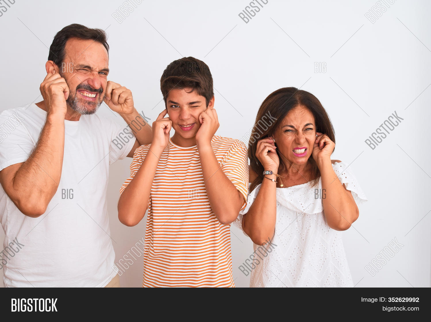 annoyed, 																					annoying, 																					background, 																					child, 																					cover, 																					covering, 																					deaf, 																					ear, 																					ears, 																					emotion, 																					expression, 																					family, 																					father, 																					fingers, 																					gesture, 																					grey hair, 																					hand, 																					hands, 																					headache, 																					hear, 																					hearing, 																					isolated, 																					listen, 																					loud, 																					middle age, 																					migraine, 																					mother, 																					music, 																					noise, 																					noisy, 																					pain, 																					parents, 																					people, 																					person, 																					portrait, 																					problem, 																					senior, 																					silence, 																					son, 																					sound, 																					standing, 																					stress, 																					stressed, 																					studio, 																					together, 																					togetherness, 																					white, 																					young