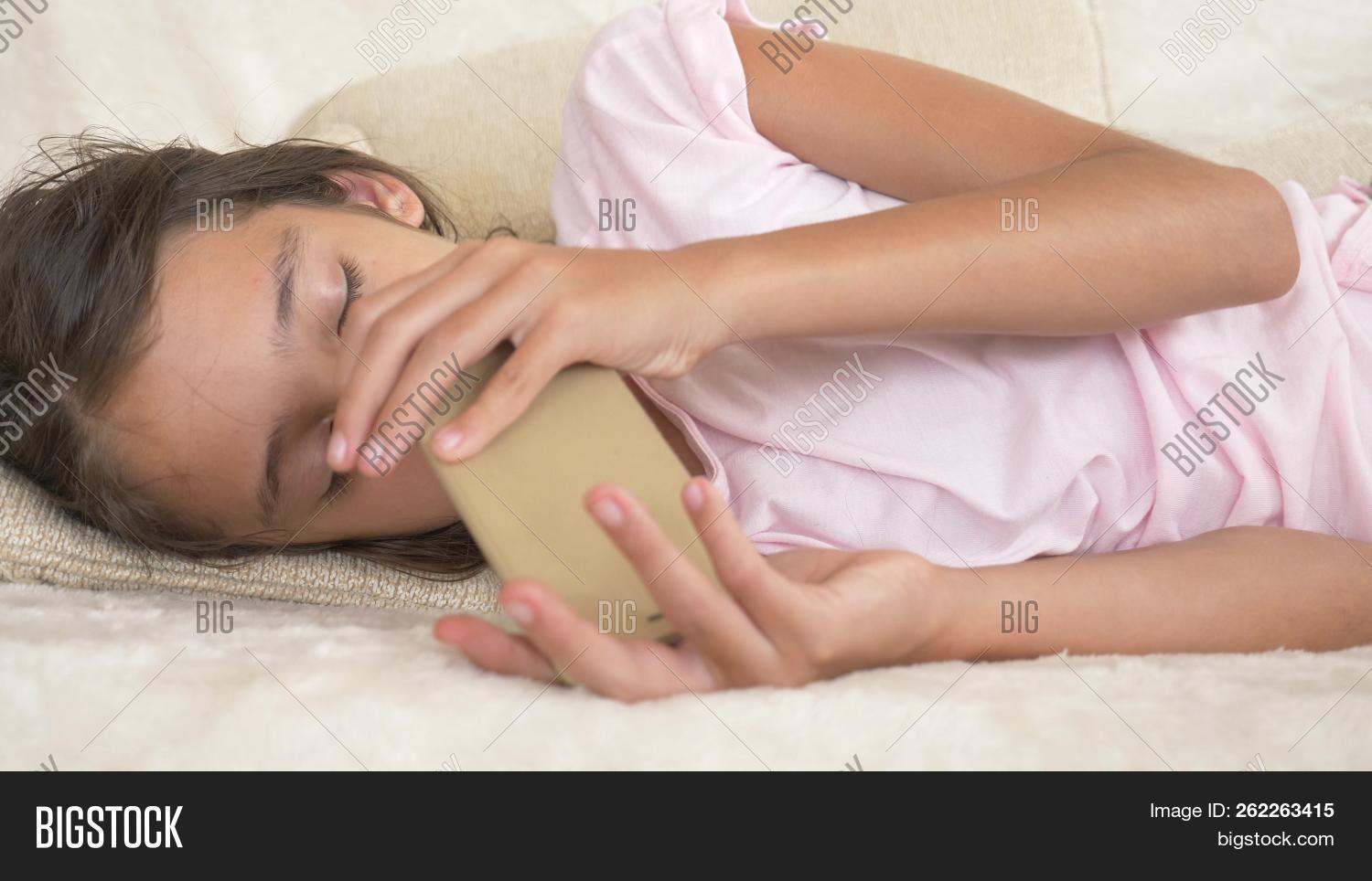 addiction,adolescence,adolescent,afternoon,asleep,attractive,beige,caucasian,child,couch,deprivation,doze,education,exhaustion,face,faint,fallen,fatigue,female,frustration,girl,health,home,indoors,kid,lack,lazy,leather,lying,nap,overworked,people,person,puberty,red,regimen,relaxation,rest,resting,room,school,sleep,sleeping,slumber,sofa,teenager,tired,yawn