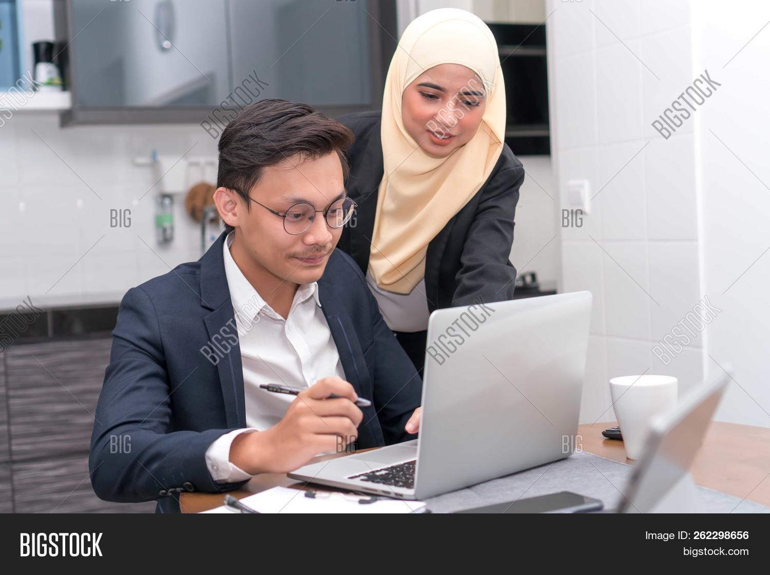 adult,arab,arabian,asian,attractive,beautiful,beauty,business,call,cheerful,communicate,communication,confidence,corporate,culture,diversity,ethnic,ethnicity,executive,face,female,girl,happy,hijab,indonesian,internet,islam,islamic,job,laptop,look,malay,malaysian,melayu,modern,muslim,muslimah,outdoor,people,person,phone,portrait,scarf,smile,technology,tradition,traditional,veiled,woman,women