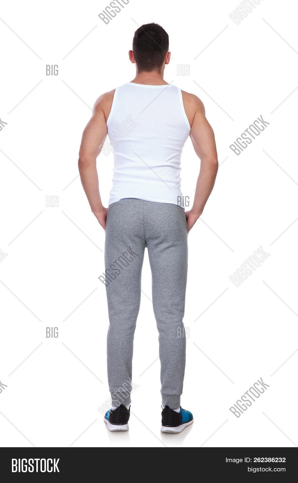 attractive,back,back view,background,behind,built,clothes,fit,fitness,full body,full length,gym,hands,handsome,happy,health,healthy,hold,isolated,lean,lifestyle,look,male,man,muscle,muscular,people,person,pockets,rear,relaxed,sexy,smile,sport,sportswear,sporty,standing,toned,top,training,undershirt,view,white