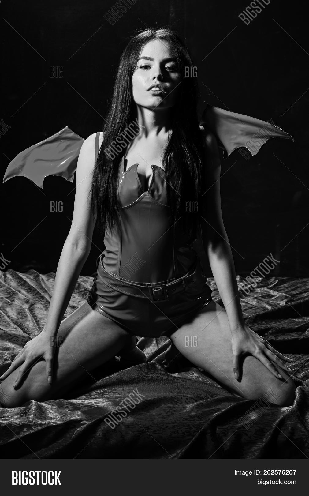 adult,background,bed,black,carnival,caucasian,celebration,concept,costume,demon,desire,devil,dressed,elegant,erotic,evil,face,fantasy,fetish,full,game,girl,gothic,halloween,hell,holiday,horror,hot,immortal,lady,like,love,mystery,nightmare,passion,passionate,play,red,role,sexi,sexy,sheets,silk,sit,temptress,wing,woman