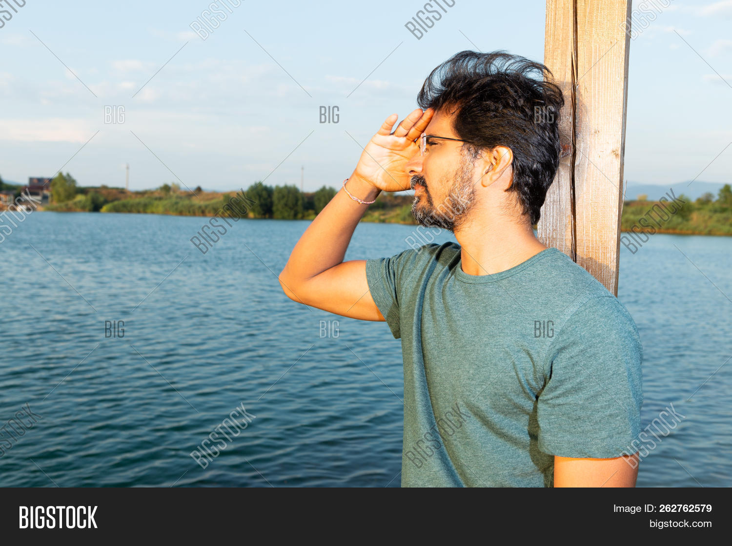 adult,artistic,away,background,bar,beard,blue,concept,dreaming,eyeglasses,face,facial,far,forehead,glasses,goggles,hair,hand,indian,lake,landscape,leaning,looking,male,man,nature,outdoor,person,photography,portrait,post,profile,protecting,shore,side,side-view,spectacles,unshaven,view,watching,water,wondering,wooden