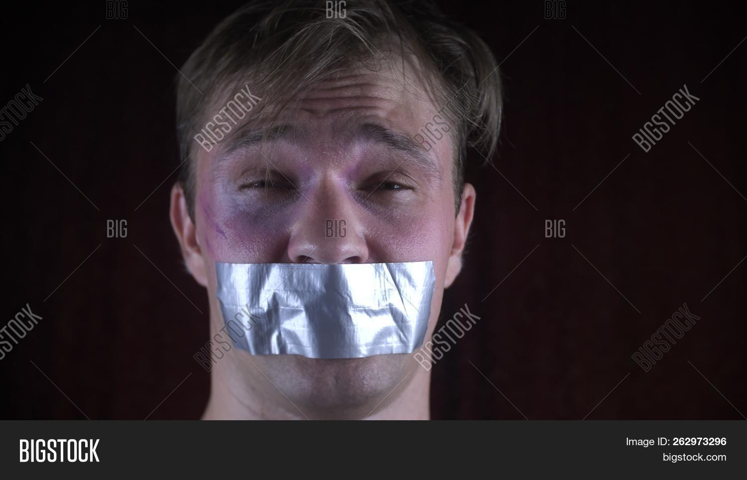 abuse,abused,abusing,adhesivetape,adult,aggressive,angry,bandit,barnacle,captive,captured,concept,couple,crime,criminal,cruel,danger,dependency,despair,evil,family,fear,gag,guy,hands,hostage,human,kidnapping,male,man,people,person,physical,prisoner,problems,ransom,rope,scared,slave,slavery,snatch,social,tape,terrified,tied,trafficking,trapped,victim,violence,young