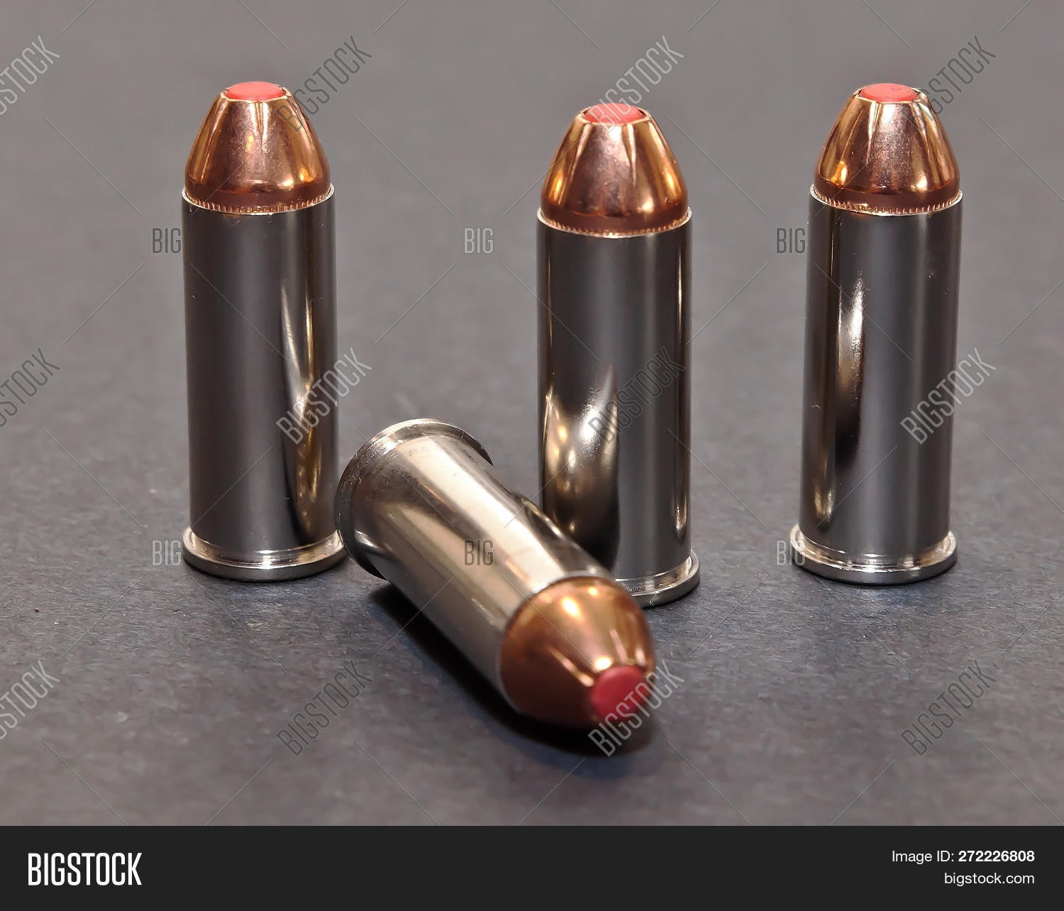 44,ammo,ammunition,background,brass,bullets,caliber,cartridge,closeup,copper,defense,defensive,equipment,forty-four,four,gray,group,handgun,hollow,isolated,lead,lethal,lined,metal,munition,new,objects,point,power,projectile,protection,red,rounds,security,set,shell,shiny,shot,small,special,spl,studio,tip,together,up