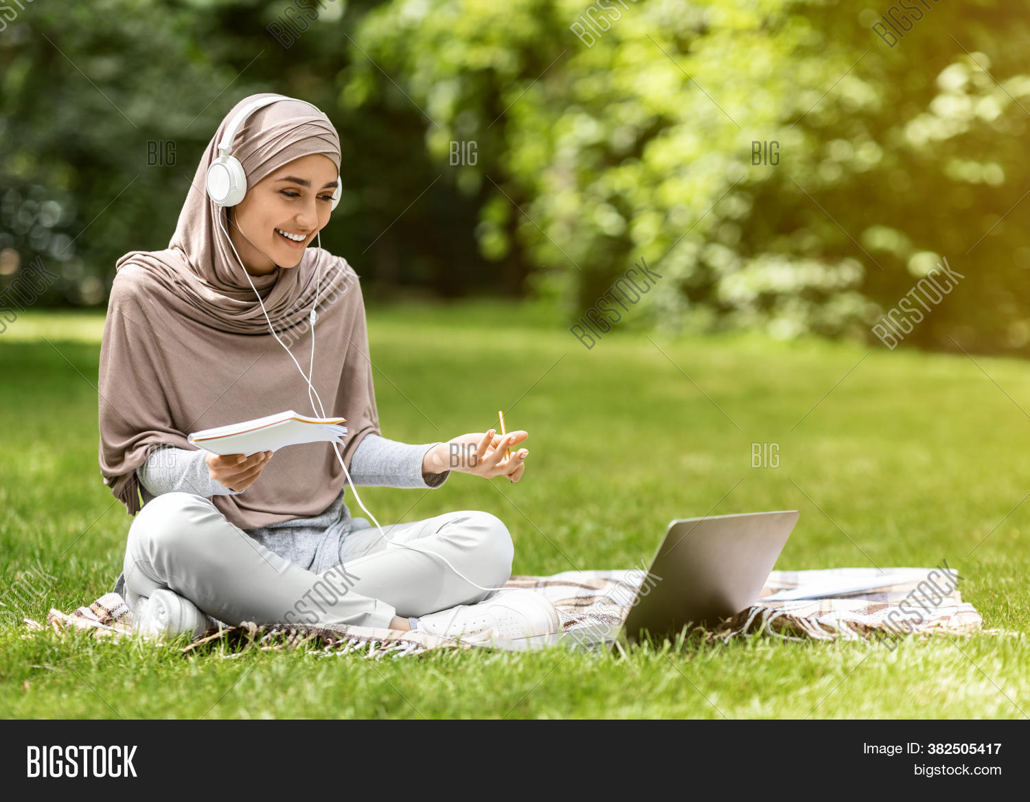 young, 																					muslim, 																					woman, 																					student, 																					hijab, 																					smiling, 																					happy, 																					headset, 																					laptop, 																					talking, 																					conference, 																					videocall, 																					videochat, 																					studying, 																					online, 																					lesson, 																					school, 																					conversation, 																					female, 																					park, 																					culture, 																					scarf, 																					tradition, 																					traditional, 																					beautiful, 																					adult, 																					face, 																					smile, 																					religion, 																					arab, 																					lifestyle, 																					outdoor, 																					clothing, 																					forest, 																					happiness, 																					attractive, 																					green, 																					joy, 																					joyful, 																					cheerful, 																					positive, 																					technology, 																					computer, 																					earphones, 																					university, 																					notebook