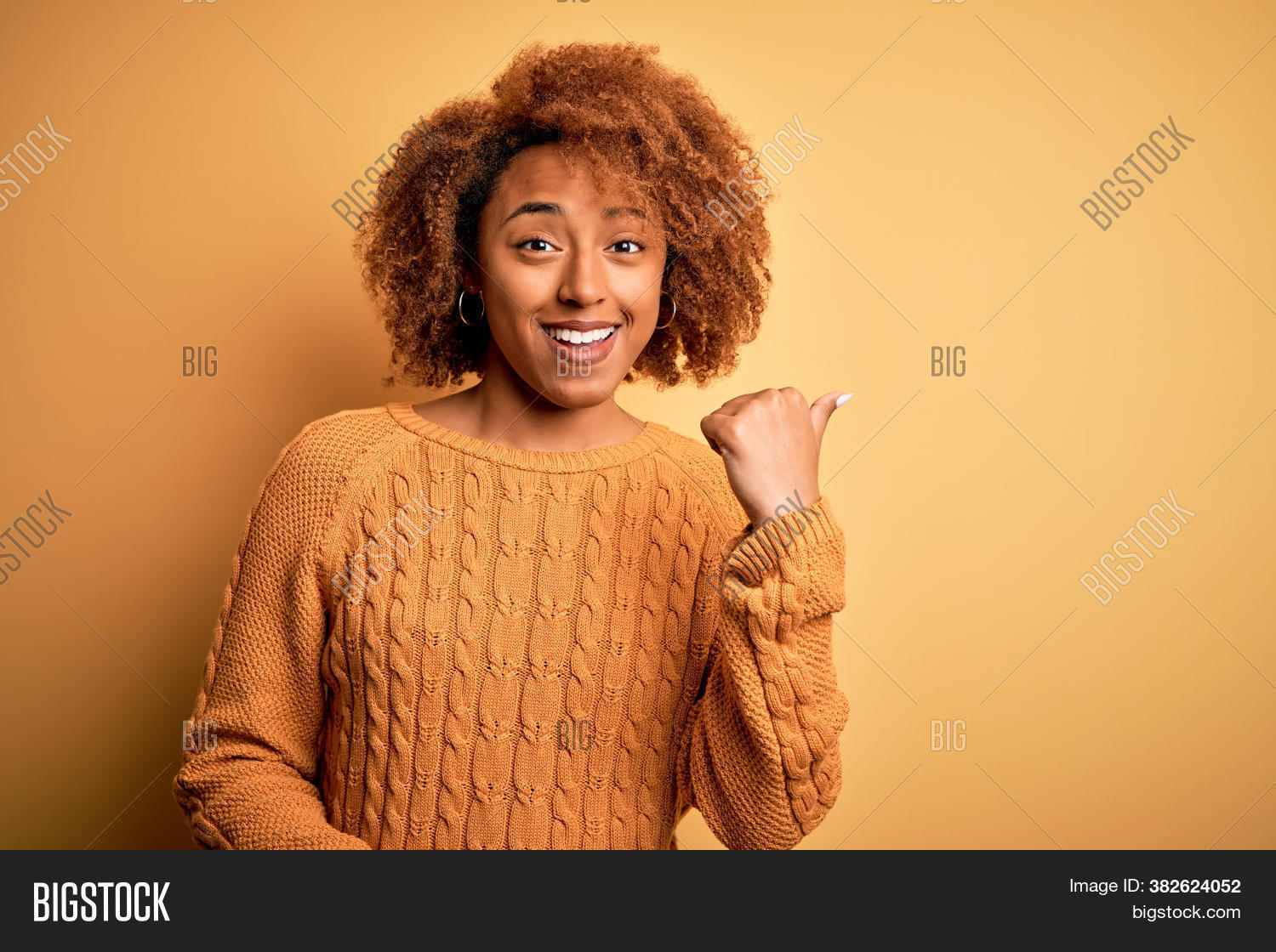 advertising, 																					african, 																					afro, 																					american, 																					arm, 																					attractive, 																					away, 																					background, 																					beautiful, 																					black, 																					casual, 																					cheerful, 																					confident, 																					cool, 																					copy space, 																					curly, 																					expression, 																					fashion, 																					finger, 																					great, 																					hair, 																					hand, 																					happy, 																					isolated, 																					joy, 																					laugh, 																					look, 																					looking, 																					people, 																					person, 																					point, 																					pointed, 																					pointing, 																					portrait, 																					positive, 																					product, 																					show, 																					showing, 																					side, 																					smile, 																					smiling, 																					space, 																					standing, 																					sweater, 																					thumb, 																					up, 																					winter, 																					woman, 																					yellow, 																					young