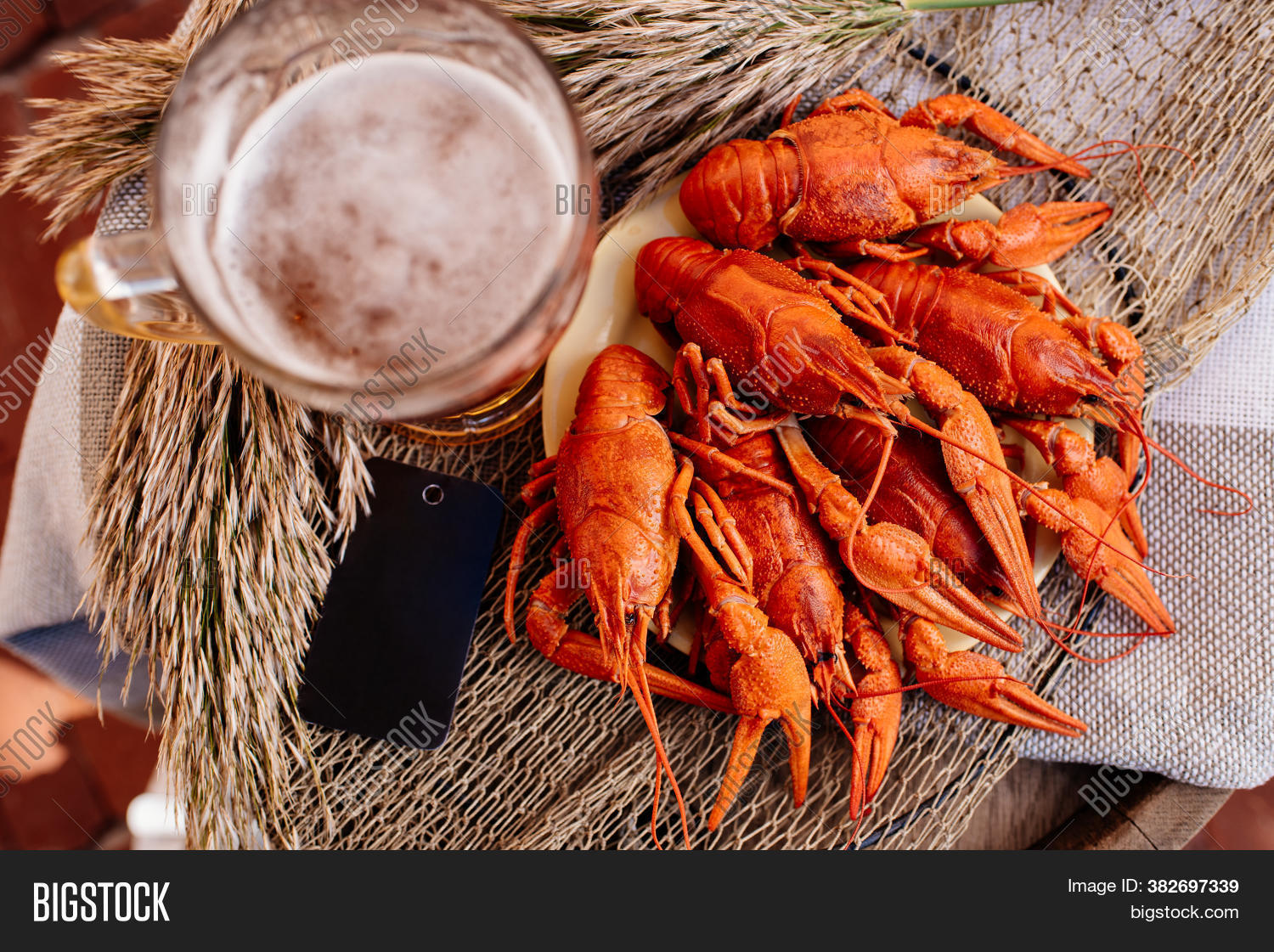 Boiled Crayfish And Golden Beer On A Wooden Barrel On Brick Wall Background Image Stock Photo
