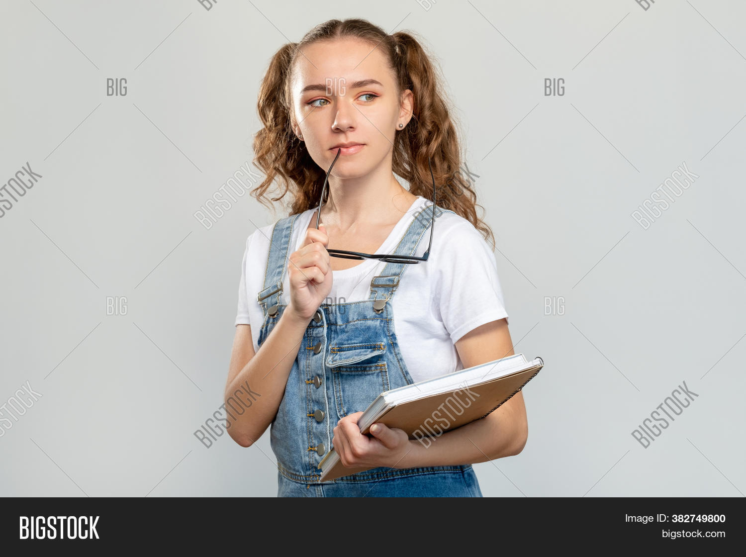 thoughtful, 																					smart, 																					teen, 																					girl, 																					books, 																					eyeglasses, 																					isolated, 																					light, 																					background, 																					college, 																					library, 																					knowledge, 																					information, 																					curious, 																					student, 																					portrait, 																					education, 																					doubtful, 																					task, 																					solution, 																					pensive, 																					school, 																					exam, 																					idea, 																					confident, 																					university, 																					study, 																					class, 																					lesson, 																					course, 																					lifestyle, 																					casual, 																					neutral, 																					white, 																					gray, 																					caucasian, 																					people, 																					person, 																					adult, 																					young, 																					female, 																					woman, 																					lady, 																					copyspace