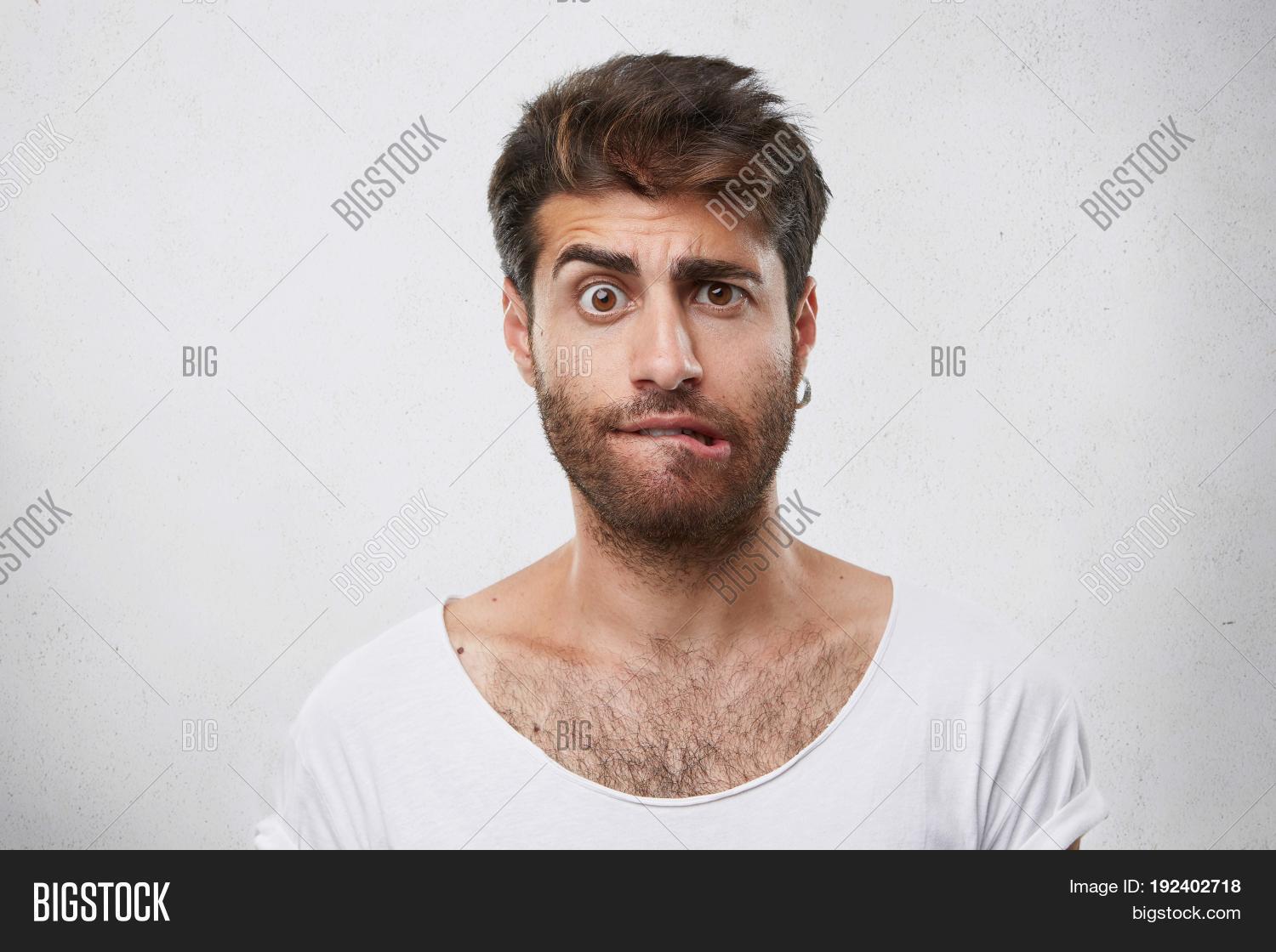 adult,amazing,astonishment,attractive,background,beard,biting,boy,casual,caucasian,concept,cool,crazy,cute,daze,doubt,emotions,eyebrows,face,facial,frowning,fun,funny,guy,hair,hairstyle,handsome,happy,head,isolated,joy,lifestyle,lips,looking,male,man,mouth,nervous,people,person,portrait,shock,student,studio,stupor,surprise,wall,white,wonder,young