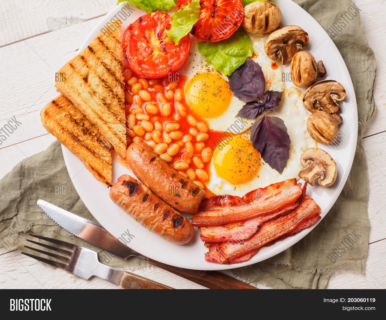 american,bacon,baked,bean,bread,breakfast,british,buttered,calories,cholesterol,closeup,cooked,cuisine,disease,dish,egg,english,fat,food,fork,fried,full,greens,grill,grilled,juice,knife,meal,meat,morning,mushroom,orange,plate,pork,protein,roasted,sausage,slice,tasty,tea,toast,tomato,traditional,unhealthy,white,yolk