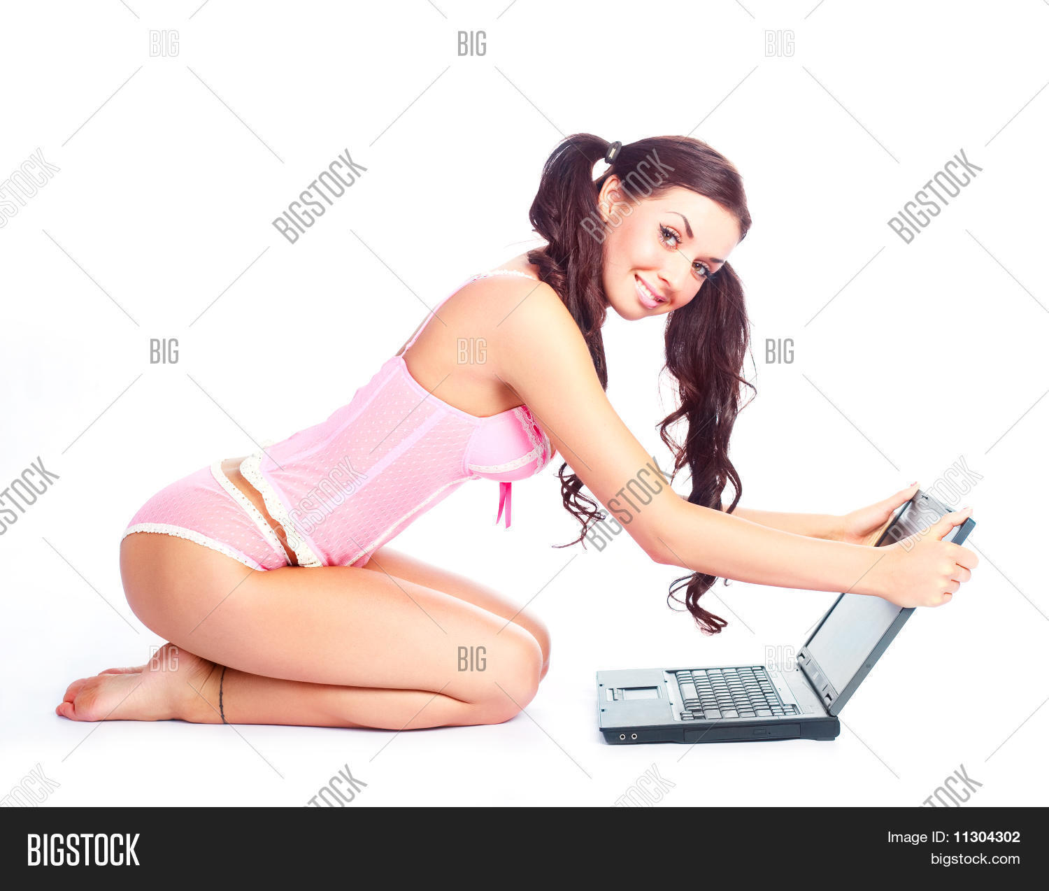 attractive,barefoot,beautiful,body,brunette,cheerful,computer,confident,corset,equipment,female,floor,fun,games,girl,glamorous,glamour,happy,hips,hold,internet,isolated,joyful,laptop,leisure,model,pants,pink,play,pretty,sexuality,sexy,sit,slim,smile,studio,technical,technology,underwear,use,wear,woman,work,young,youth