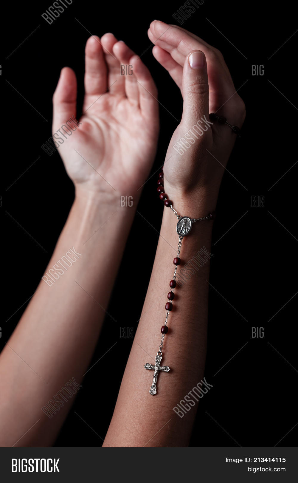 air,arms,beads,belief,believe,believer,black background,catholic,catholicism,christ,christian,christianity,church,close up,closeup,cross,crucifix,faith,faithful,female,god,hands,holding,jesus,jesus christ,meditation,outstretched,pray,prayer,praying,religion,religious,rosary,rosary beads,spiritual,spirituality,symbol,woman,worship