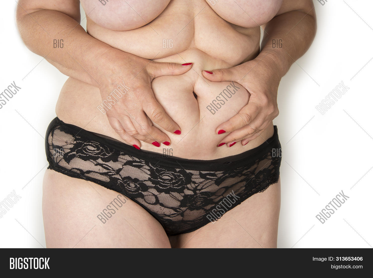abdomen,adult,age,aged,aging,alone,america,american,beautiful,body,care,caucasian,cellulite,chunky,closeup,concept,disease,elderly,fat,female,hands,heavyset,lady,mature,obese,obesity,old,overweight,person,portly,pretty,problem,pulling,retirement,russian,single,skin,solo,westerner,white,woman