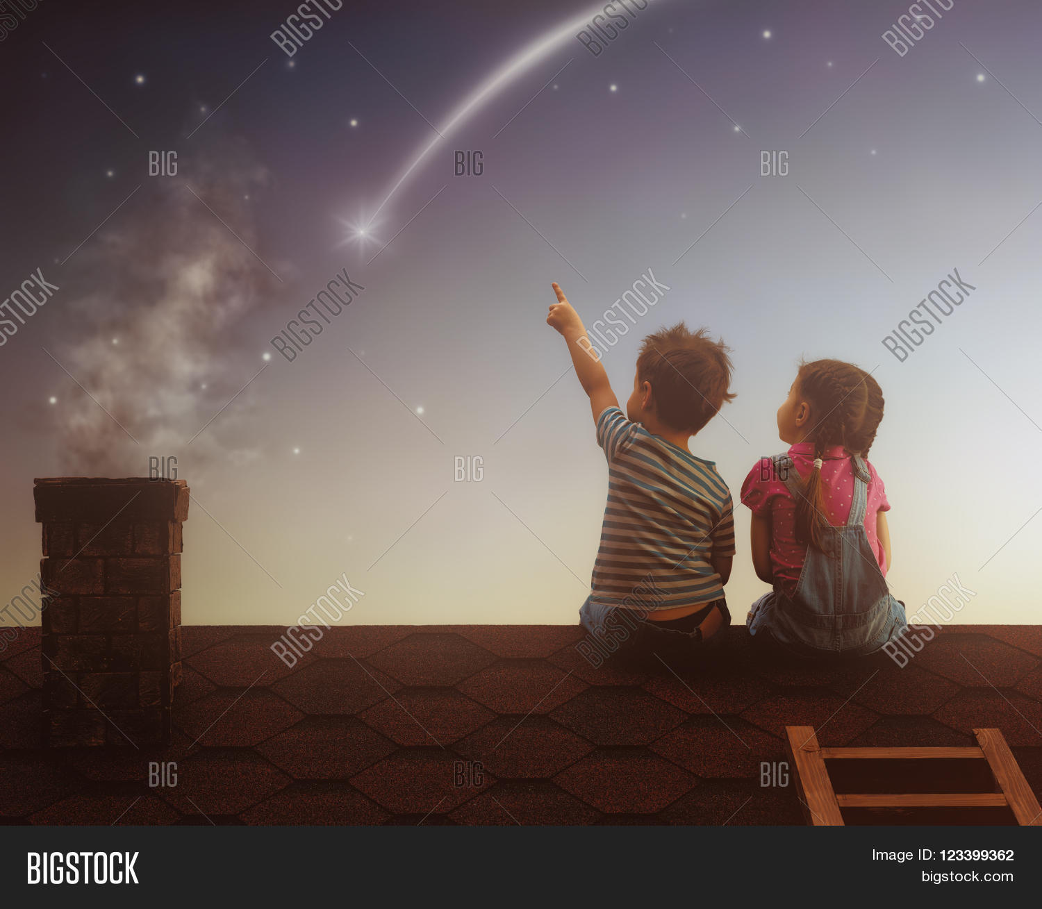 Two cute children sit on the roof and look at the stars. Boy and girl ...