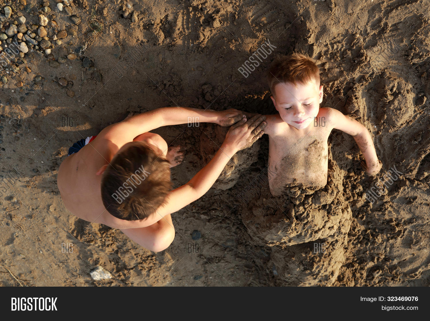 active,attractive,azov,beach,boy,brother,buried,bury,caucasian,cheerful,child,childhood,coast,creative,cute,dirty,face,family,fill,freedom,fun,funny,game,happiness,happy,holiday,joy,kid,life,lifestyle,lying,male,nature,outdoor,people,person,play,portrait,real,russian,sand,sandy,sea,shore,smile,son,summer,summertime,two,vacation