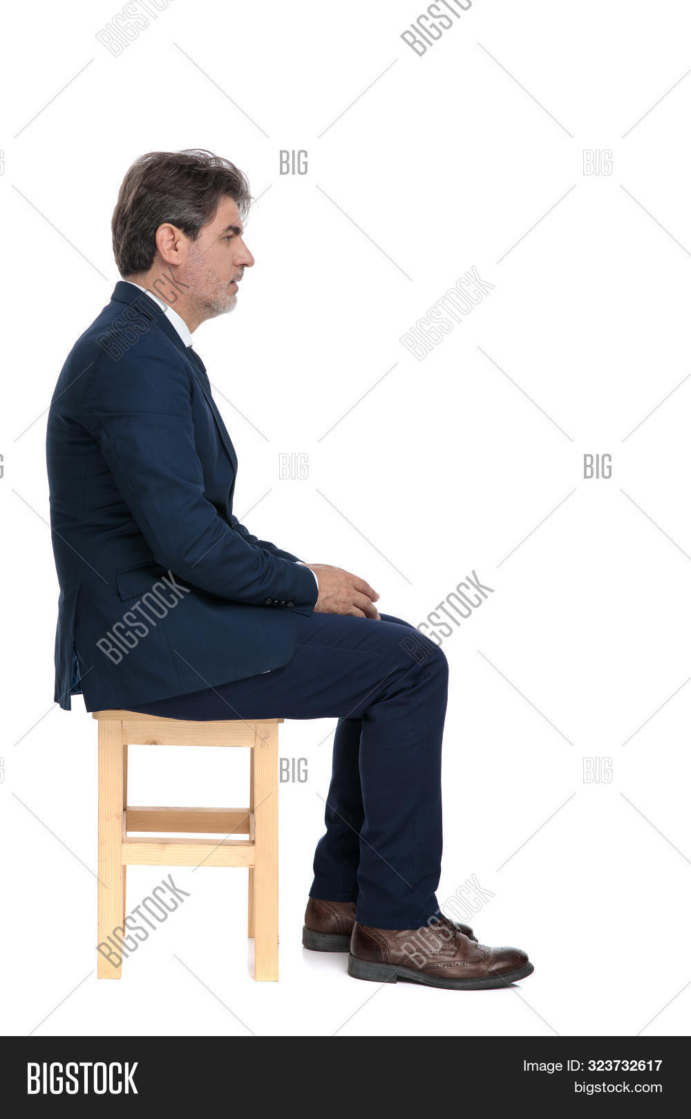adult,ahead,attractive,background,brown,business,businessman,chair,deliberate,elegant,fashion,formal,full body,full length,genuine,grey,guy,hair,hairstyle,hands,handsome,happy,hold,honest,look,man,mature,model,modern,navy,old,people,person,seated,senior,serious,side,side view,sincere,sitting,smile,somber,style,suit,tie,wear,white,wooden