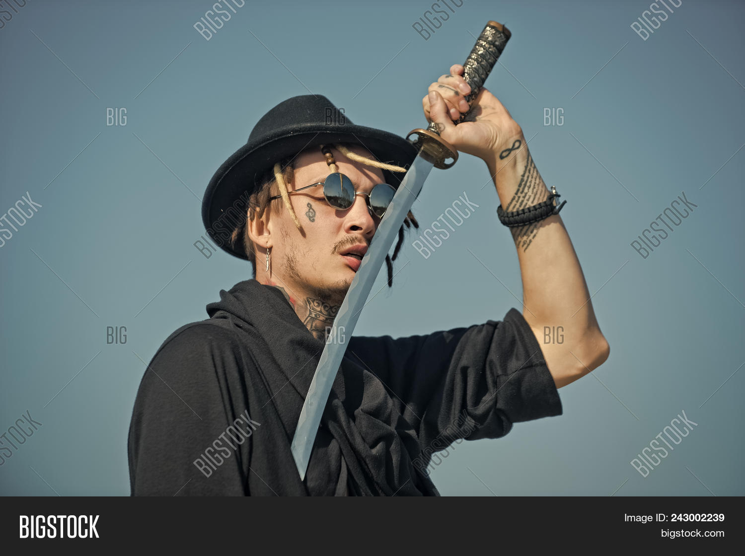 aggressive,arts,black,blade,blue,buddhist,clothes,concentration,concept,defense,force,fu,harakiri,hat,holding,honor,japan,katana,kendo,killer,kung,man,martial,meditation,metal,metallic,metallized,monk,noble,outdoors,power,samurai,shaolin,sky,soldier,sunglasses,sword,tattoo,warrior,weapon,zen