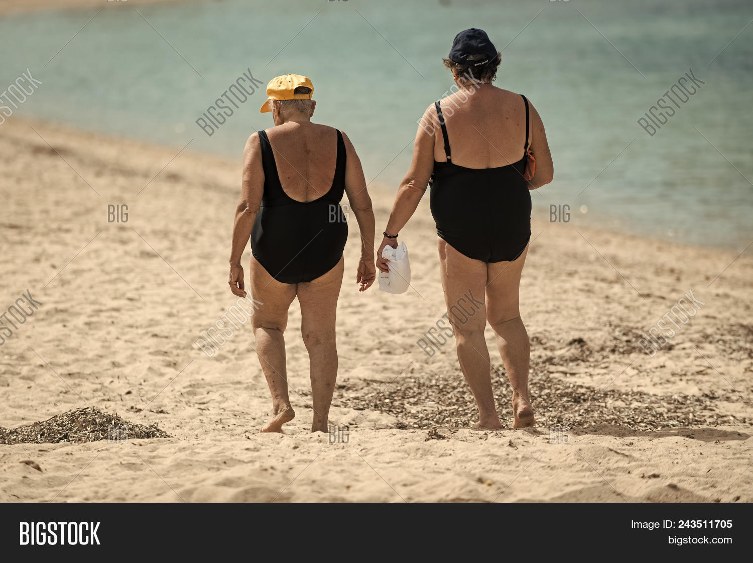 active,aged,background,beach,beauty,concept,elderly,enjoyment,entertaiment,female,fun,granny,holiday,lady,leisure,ocean,old,outdoor,pleasure,rear,recreation,relax,relaxation,resort,rest,retired,sand,sea,seashore,senior,summer,sunlight,suntan,surf,swimsuit,swimwear,tan,tourism,tourist,travel,vacation,view,walk,water,wave,woman,women
