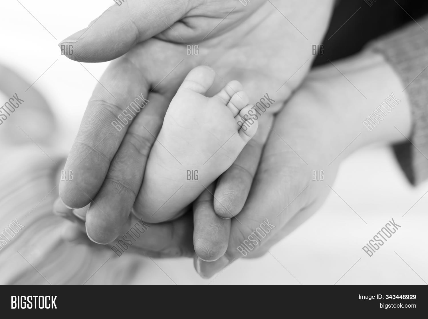 adult,affection,baby,birth,boy,card,care,caress,child,childhood,cuddling,dad,daughter,family,father,fatherhood,foot,generation,girl,hand,happy,holding,hospital,hugging,infant,kid,kissing,love,male,man,middle,monochrome,newborn,nurseling,parent,parenthood,people,person,portrait,safety,small,soft,son,tenderness,tiny,tired,warmth
