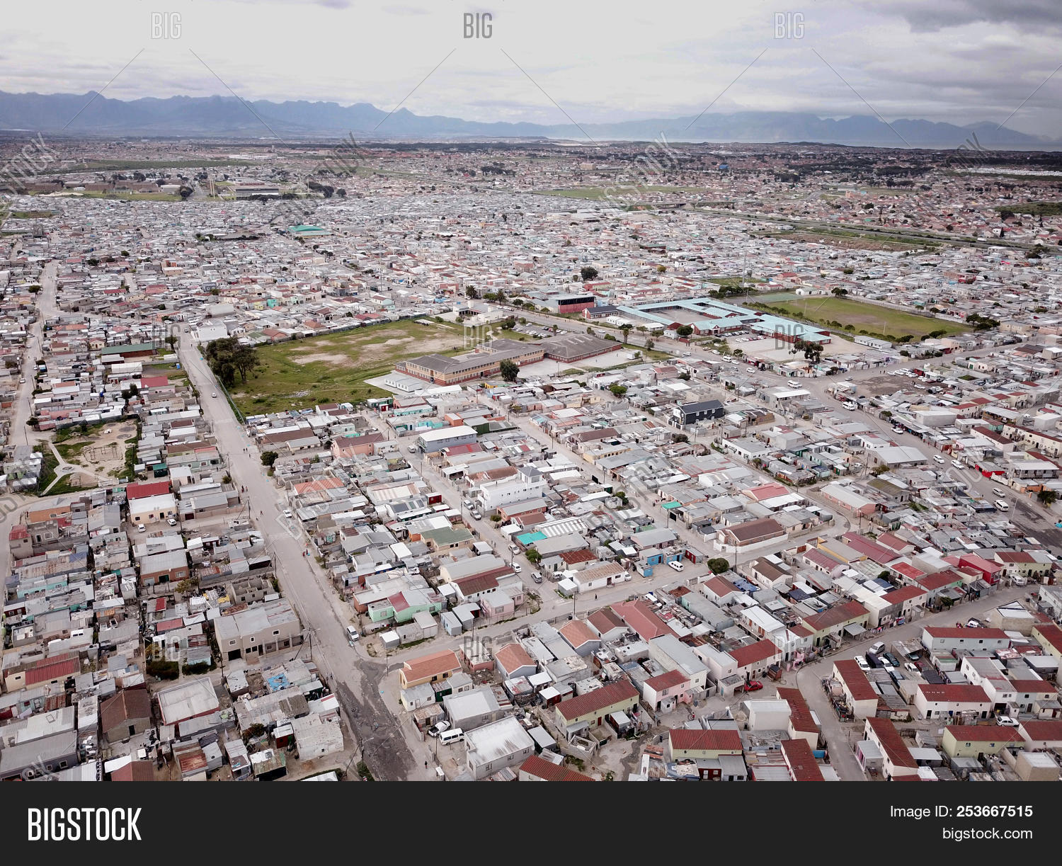 above,aerial,africa,apartheid,camp,cape,city,crowded,drone,housing,income,informal,landscape,low,low-cost,overcrowded,poor,populated,population,poverty,problem,rdp,residential,settlements,shacks,shanty,slums,south,sprawl,squatter,tin,town,townships,urban,vast,view,village
