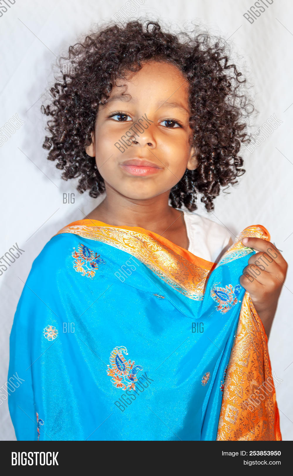 Portrait Of A Mixed Ethnisity Little Girl With Curly Hair