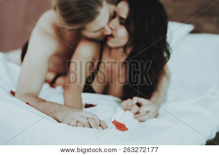 Undressed Man Kisses Woman. Person In Black Underwear. White Linens. Woman With Sexy Man Topless. Gi