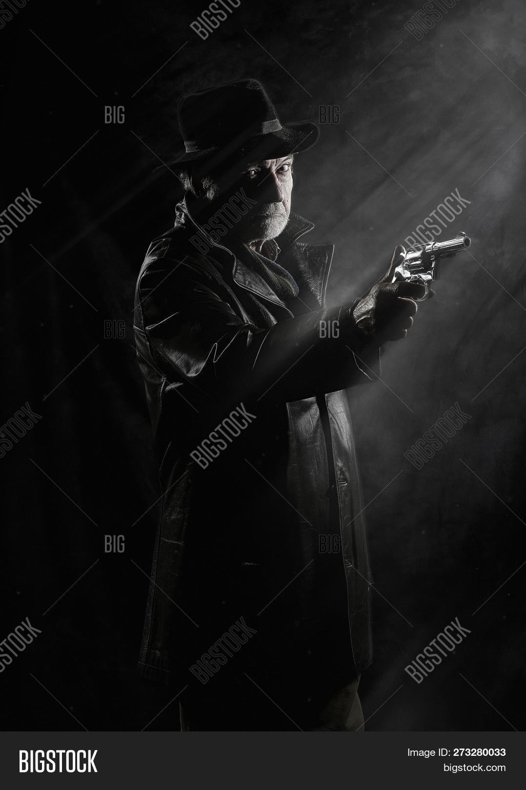 1950s,Bogart,Detective,Gun,Handgun,Police,Private,Revolver,agency,agent,armed,backdrop,background,bearded,bodyguard,character,coat,crime,dark,dramatic,equipment,film,firearm,gangster,glamour,hat,holding,investigator,isolated,male,man,mobster,mystery,noir,old,person,pistol,pointing,profession,professional,protection,retro,secret,style,thriller,trench,vintage,weapon,work,worker