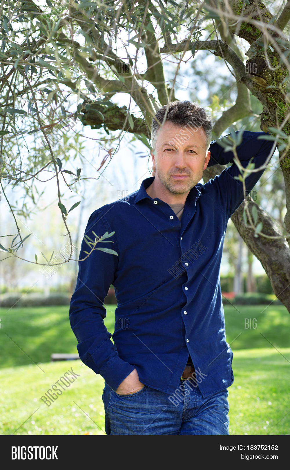 40s,45-50,attractive,beautiful,beauty,branch,casual,caucasian,cheerful,confident,european,expressions,face,fashion,foliage,garden,gray-haired,gray-headed,grove,guy,handsome,leaves,lifestyle,macho,man,manful,masculine,mature,mediterranean,middle-aged,model,modern,nature,olive,outdoor,outside,park,people,person,portrait,positive,sexy,spring,stylish,tree