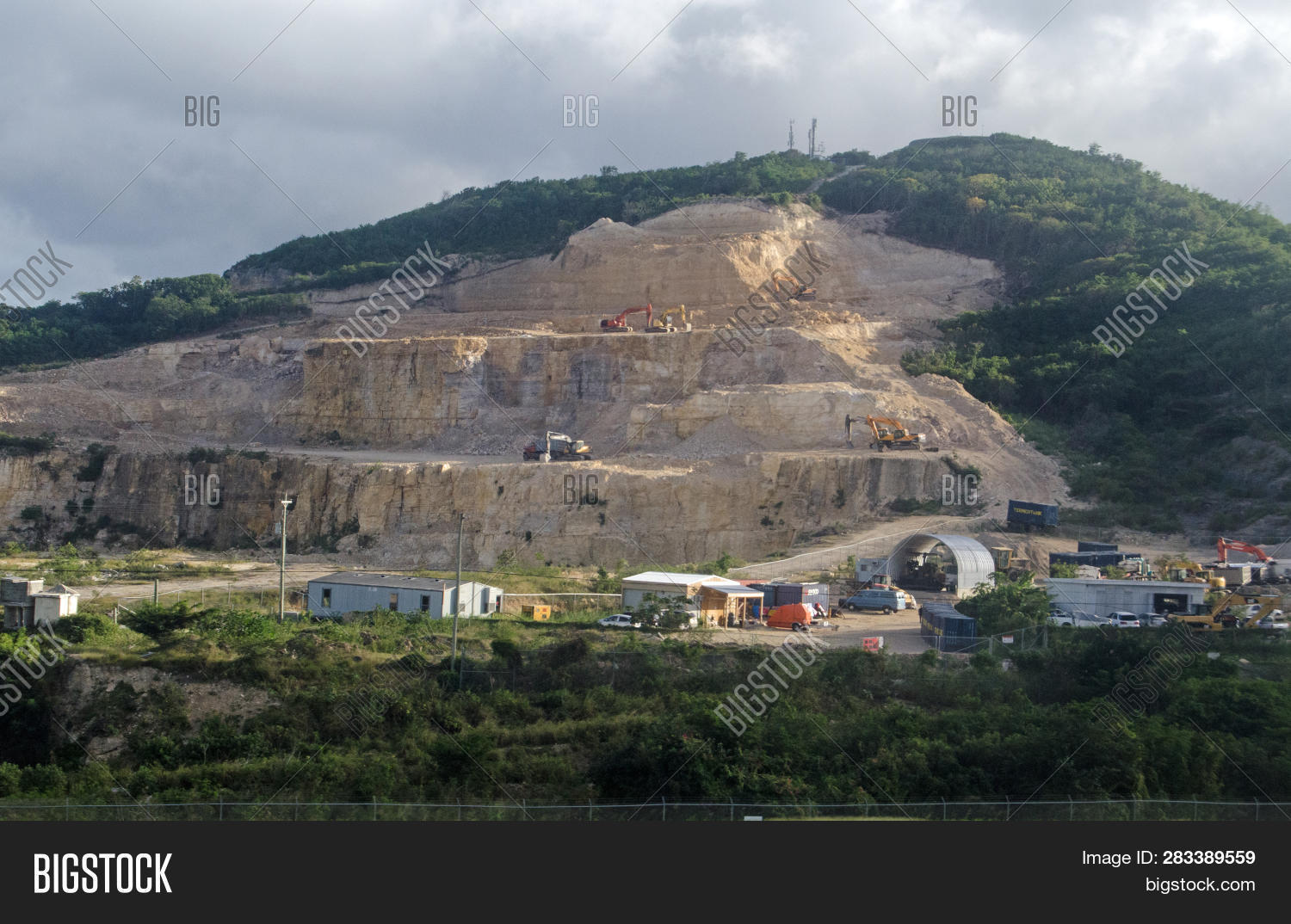 Antigua,Barbuda,Caribbean,JOhn's,St,aggregate,and,digger,extraction,extractive,hill,horizontal,industrial,industry,lorry,machinery,machines,minerals,outdoors,quarry,scar,shed,stone,sundhine,sunny,ugly,works