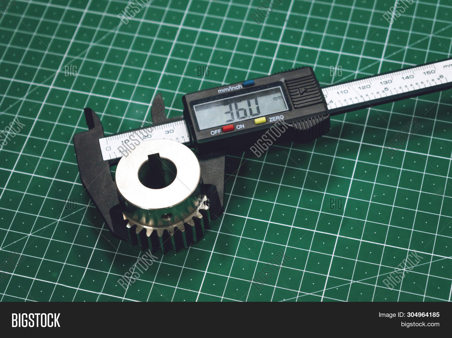 Digital,accurate,calculating,caliper,centimeter,check,closeup,construction,control,craftsman,device,engineer,engineering,gear,green,inch,industrial,industry,inspection,instrument,laborer,man,manufacture,manufacturing,material,measure,measurement,measuring,metal,metric,metrology,millimeter,person,plant,precise,precisely,precision,proportion,quality,scale,steel,technician,tool,vernier,work,worker,workplace,workshop