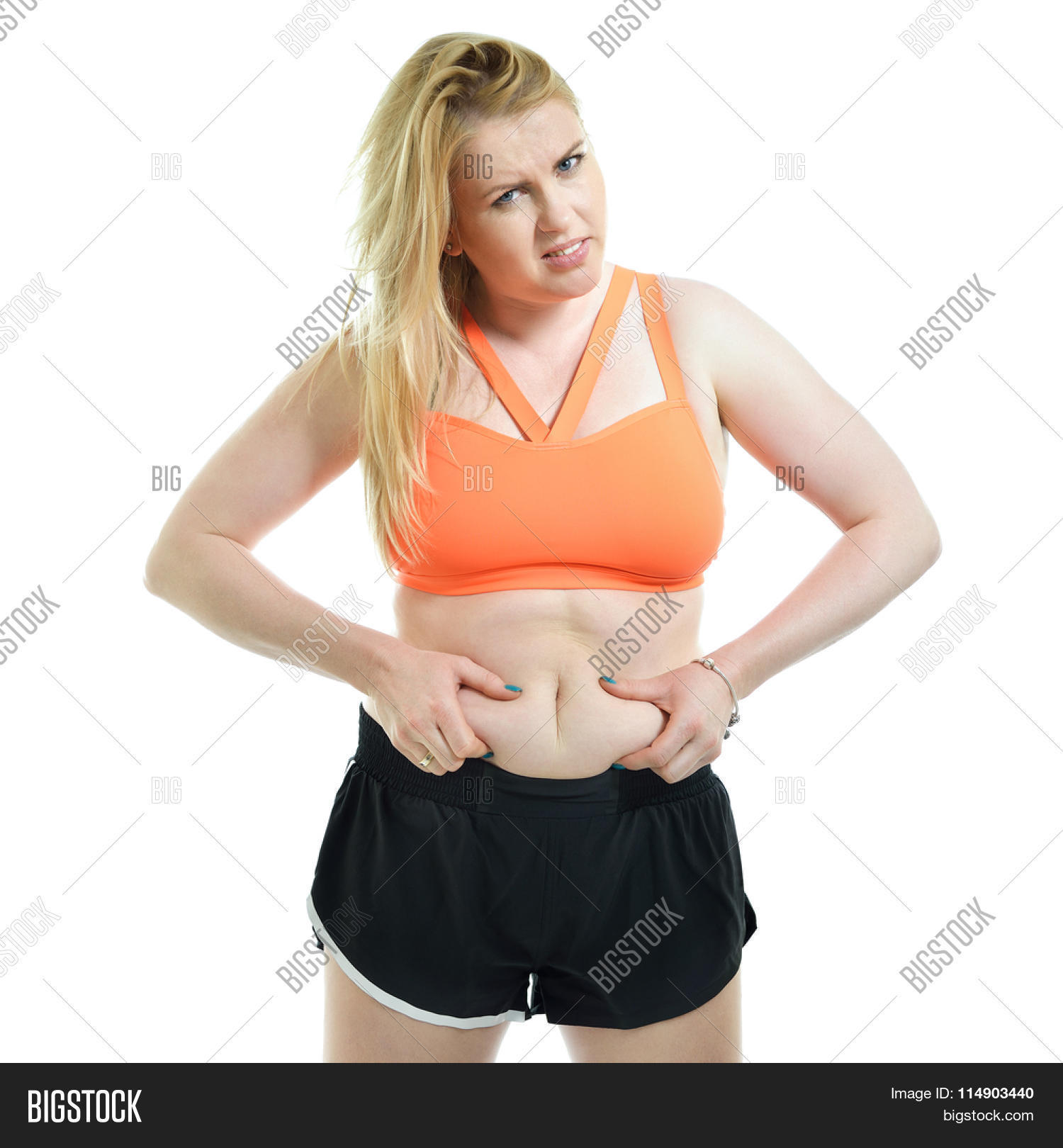 abdomen,beauty,body,caucasian,cellulite,demonstrate,diet,discontented,displeased,dissatisfied,emotional,excessive,exercise,fat,female,figure,fitness,girl,health,isolated,lady,lifestyle,losing,loss,obese,obesity,overweight,pointing,problem,show,sport,sportwear,stomach,studio,suffering,superfluous,torso,unhappy,unhealthy,waist,weight,wellness,white,women,young