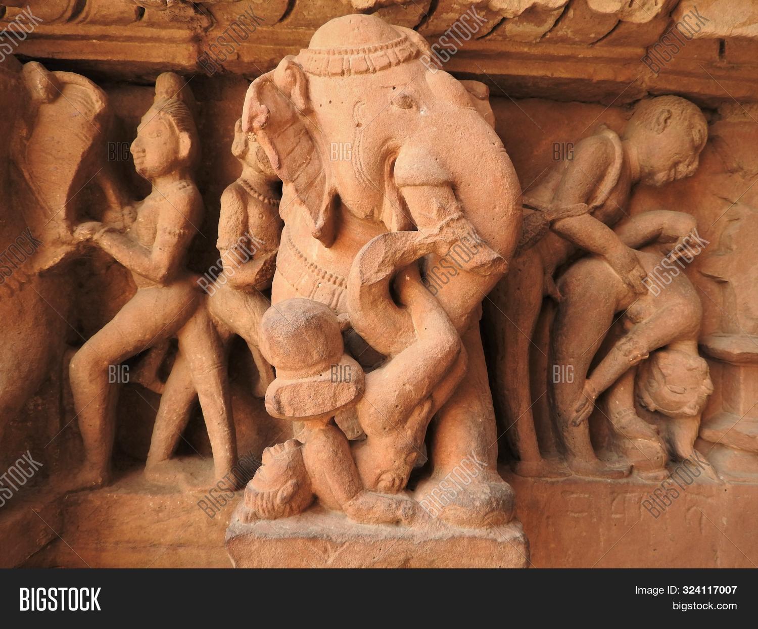 act,ancient,architectural,architecture,art,asia,attraction,building,carving,chitragupta,couples,cultural,culture,destination,erotic,exterior,heritage,hindu,hinduism,historic,india,indian,kamasutra,kandariya,khajuraho,love,madhya,mahadev,mahadeva,old,outside,place,pradesh,religion,religious,sculpture,sexual,sexy,shiva,site,statue,stone,temple,tourism,tourist,travel,unesco,wall,worship