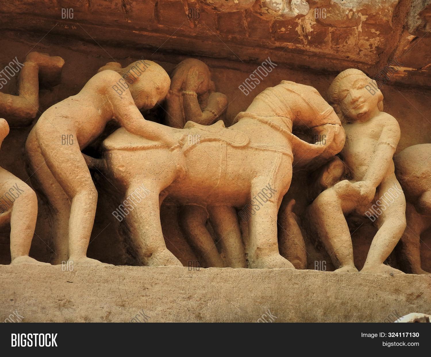 act,ancient,architectural,architecture,art,asia,attraction,building,carving,chitragupta,couples,cultural,culture,destination,erotic,exterior,heritage,hindu,hinduism,historic,india,indian,kamasutra,kandariya,khajuraho,love,madhya,mahadev,mahadeva,old,outside,place,pradesh,religion,religious,sculpture,sexual,sexy,shiva,site,statue,stone,temple,tourism,tourist,travel,unesco,wall,worship