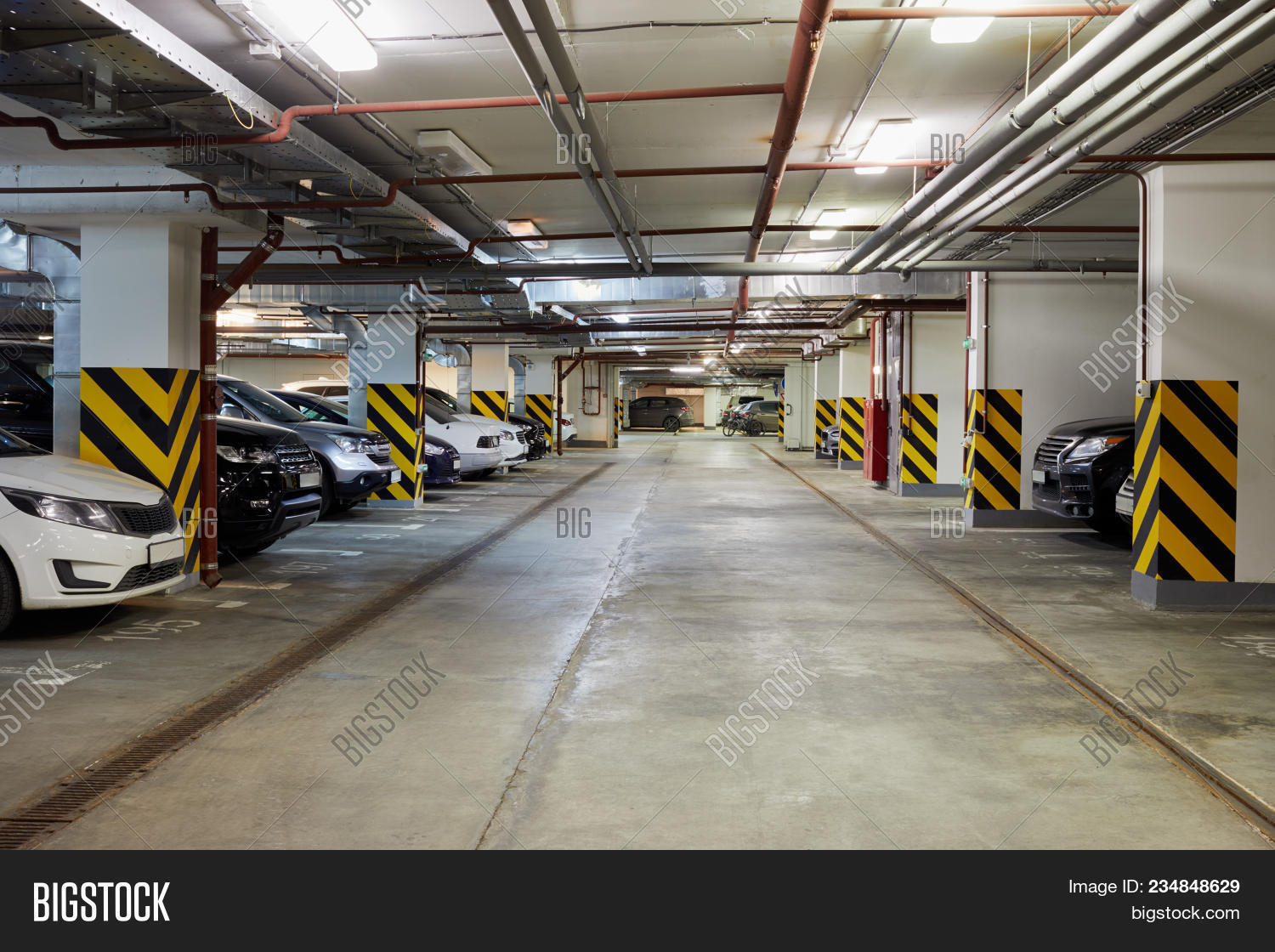 auto,automobile,basement,building,bumper,business,car,city,column,communication,concrete,control,design,drive,equipment,floor,function,garage,indoor,industry,inside,interior,lamp,large,light,marking,model,modern,nobody,parking,public,room,row,sign,signal,space,spacious,sports,stop,structure,style,traffic,transport,travel,underground,urban,vehicle,wheel,white