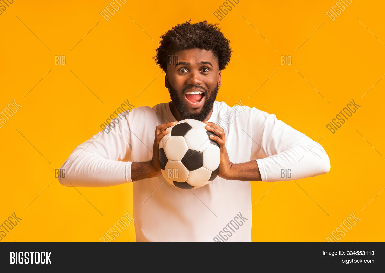 accessory,adult,background,ball,black,buff,camera,cheerful,emotional,energy,entertainment,event,excited,fan,football,footballer,friendly,fun,guy,handsome,happy,hobby,holding,human,leisure,male,man,omg,one,orange,people,person,portrait,rooter,screaming,shouting,soccer,sport,studio,supporter,young