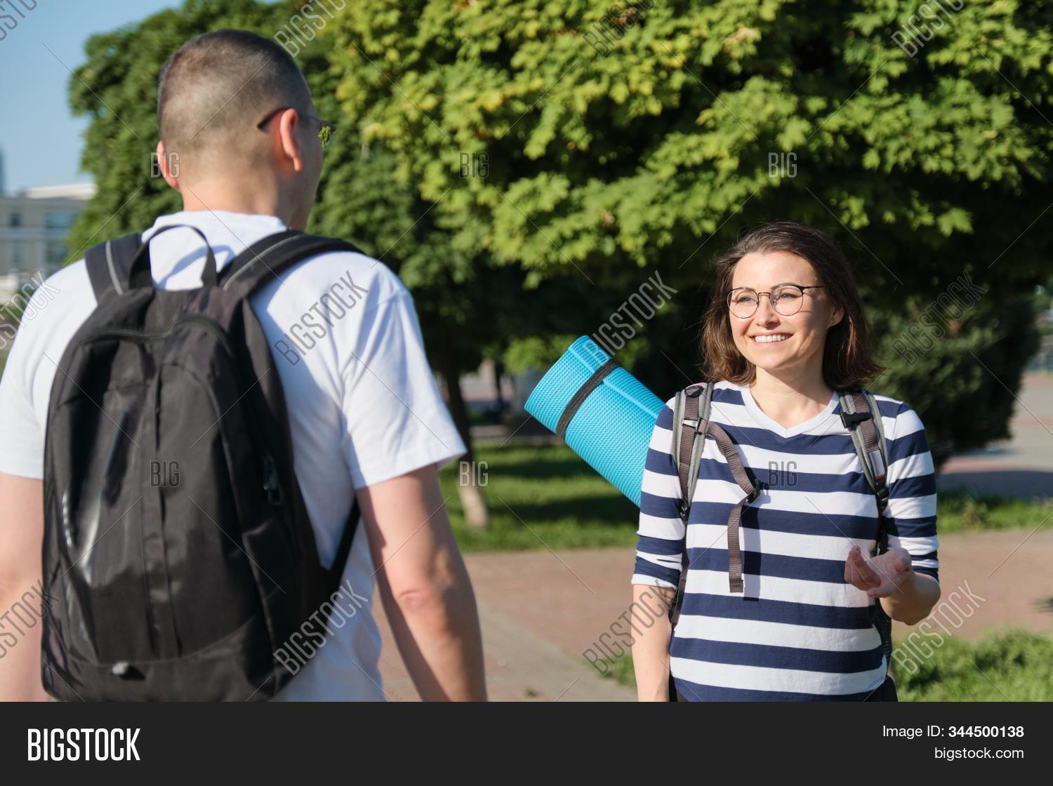 people,middle-aged,mature,couple,talking,man,woman,outdoor,happy,two,caucasian,lifestyle,40s,middle,aged,female,adult,together,male,love,person,boyfriend,leisure,smile,relationship,smiling,friend,walking,talk,portrait,walk,casual,summer,vacation,meeting,cheerful,outside,park,partner,family,flirting,urban,husband,friendship,wife,active,fitness,positive,married,going