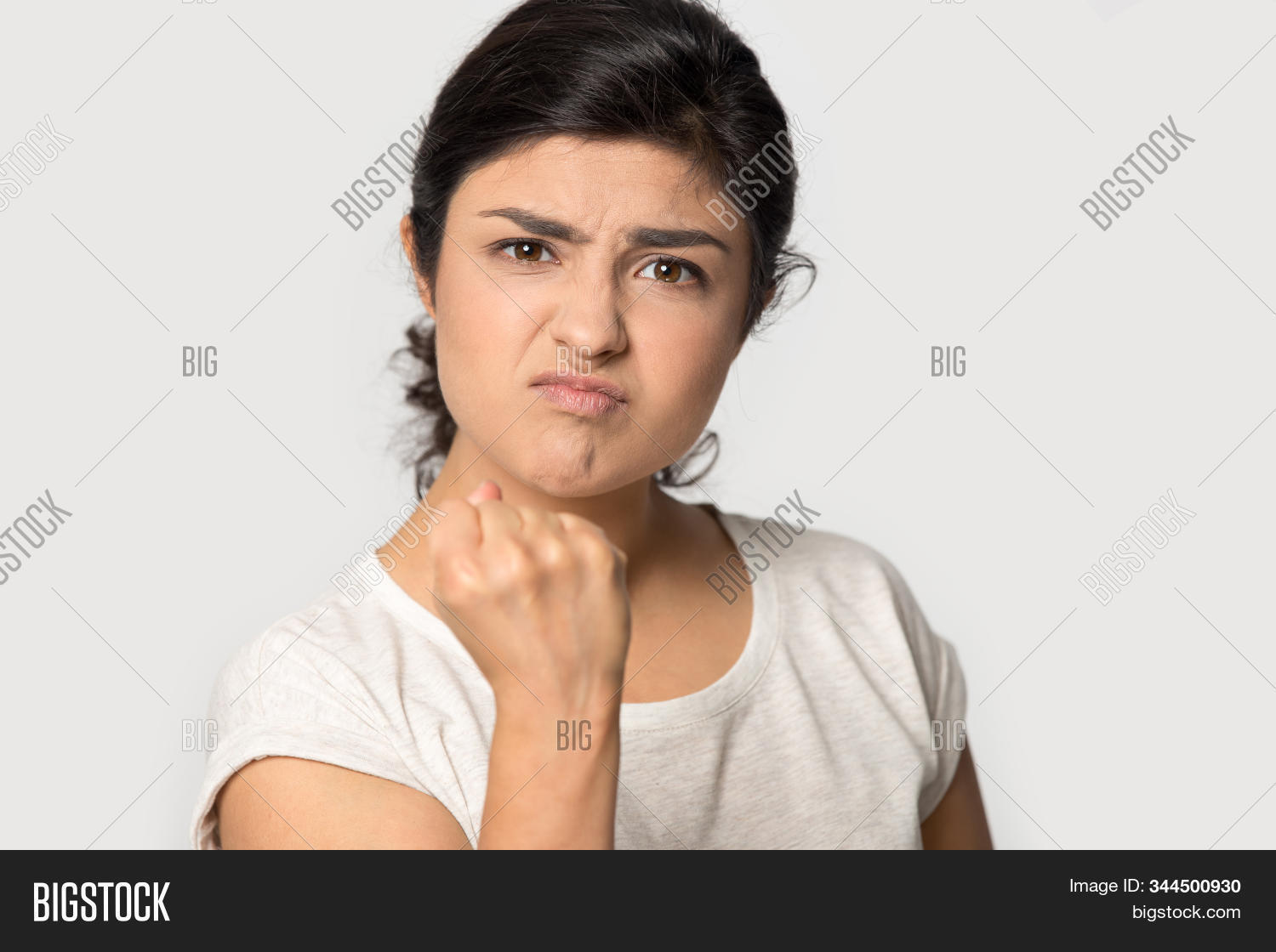 adult,aggressive,alone,anger,angry,annoyed,argue,argument,attack,authority,background,client,closeup,confident,crazy,customer,demonstrate,dissatisfied,dominant,emotions,expressing,face,female,frowning,girl,gloomy,gray,grey,headshot,indian,irritated,isolated,lady,mad,millennial,negative,nervous,portrait,power,pressure,show,stress,stressed,strict,strong,studio,warning,woman,worried,young