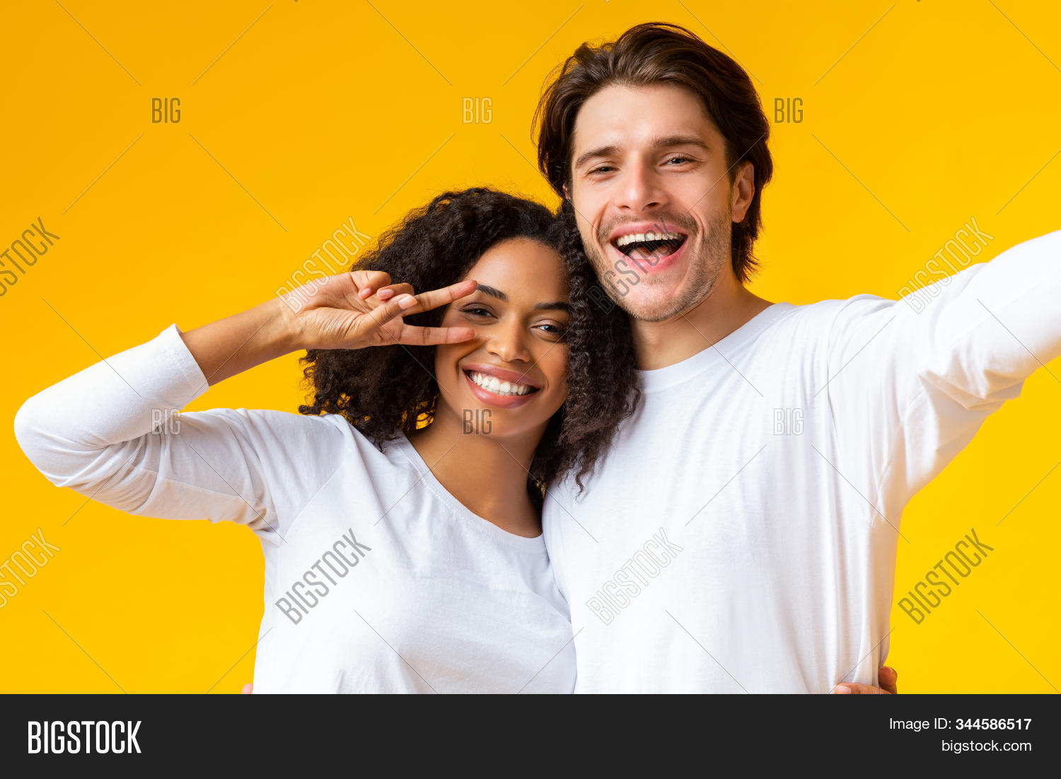 adult,together,male,smile,friendship,lifestyle,yellow,girl,friend,making,couple,portrait,fun,happiness,young,girlfriend,romantic,posing,casual,gesture,man,black,caucasian,self-portrait,mixed-race,female,taking,peace,studio,attractive,white,joyful,woman,family,background,millennial,photo,camera,happy,selfie,relationship,smiling,multiracial,love,people,boyfriend,interracial