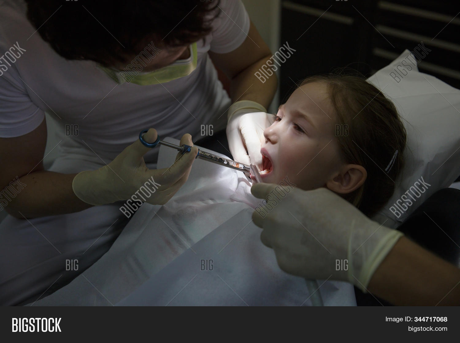 dentist,office,girl,mouth,open,dental,injection,shot,anesthesia,pediatric,treatment,local,gum,dentistry,child,scared,chair,pain,anaesthesia,tooth,examine,fright,checkup,work,paediatric,oral,tool,painful,patient,courageous,instrument,prevention,teeth,relaxed,caries,kid,filling,show,hygiene,healthcare,anxiety,practice,health,professional,baby,temporary,pedodontics,assessment