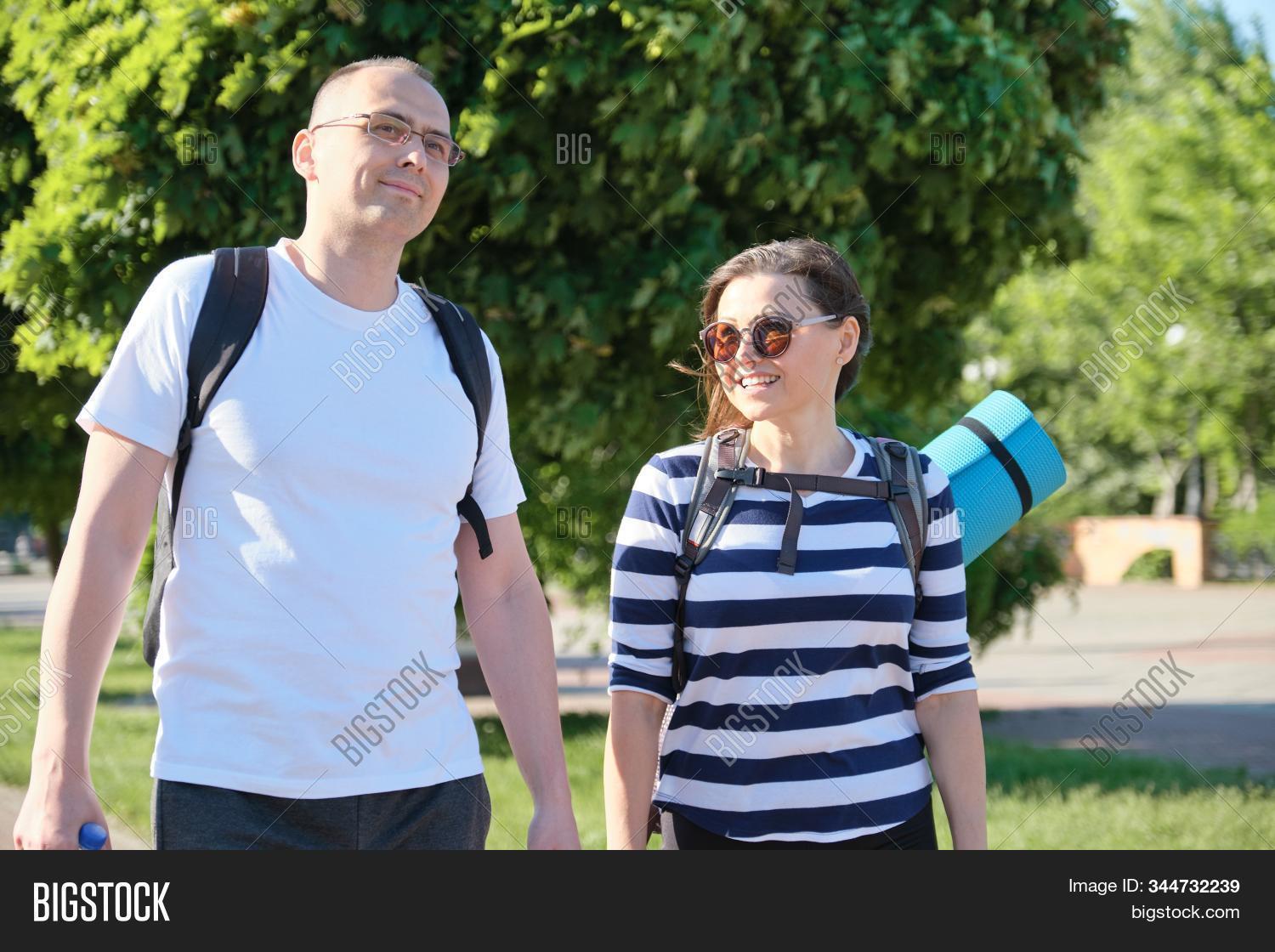 lifestyle,40s,couple,talking,walking,people,middle-aged,mature,fitness,training,man,woman,outdoor,happy,two,caucasian,middle,aged,female,adult,together,male,love,person,boyfriend,leisure,smile,relationship,smiling,friend,talk,portrait,walk,casual,summer,vacation,meeting,cheerful,outside,park,partner,family,urban,husband,friendship,wife,active,positive,married,going