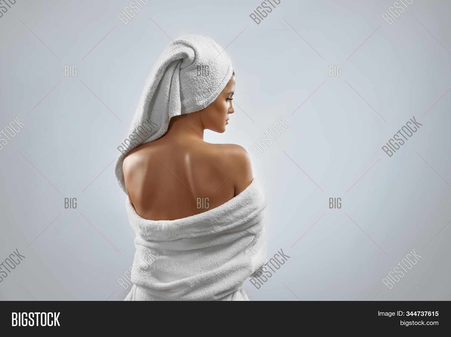 beauty,skincare,shower,spa,hygiene,face,natural,woman,bathrobe,towel,female,beautiful,bathroom,happy,caucasian,skin,isolated,robe,relax,bath,portrait,morning,young,care,girl,posing,soft,clean,person,model,enjoying,body,brunette,naked,back,shoulders,grey,studio,home,background,white,crop