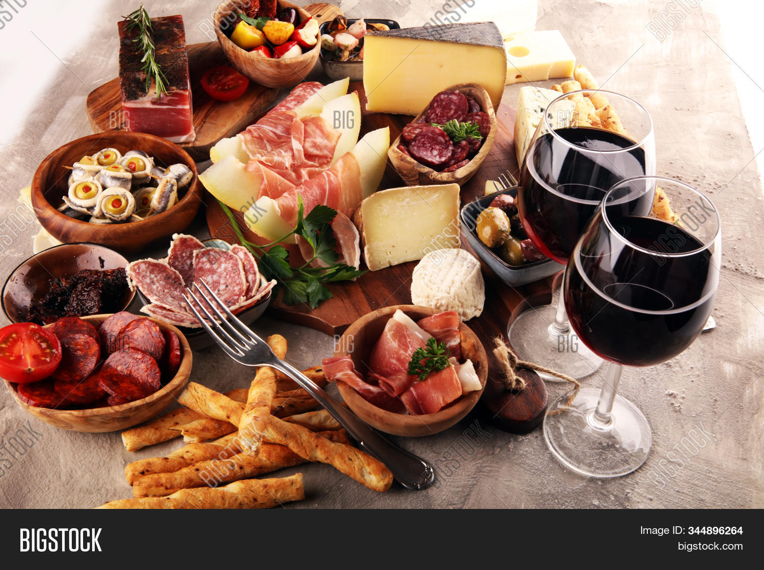antipasto,variety,wine,food,dark,restaurant,buffet,antipasti,ancovy,seafood,italian,salami,appetizer,cheese,melon,prosciutto,set,grunge,gourmet,delicatessen,rose,glass,olive,brushetta,meal,snack,board,pickle,bruschetta,fresh,dinner,fruit,drink,wooden,cuisine,meat,alcohol,tapas,bar,traditional,bread,spanish,delicious,tasty,eating,rustic,canape,oil