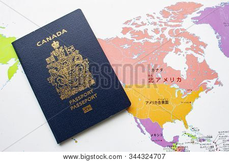 Canadian Passport Front Cover On A Map On The Background - Stock Image ...