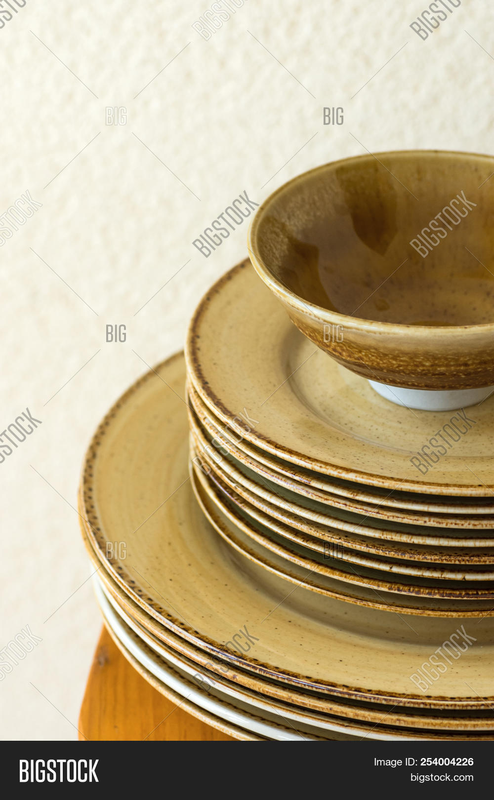 Stack Of Brown Speckled Glazed Earthenware Ceramic Plates