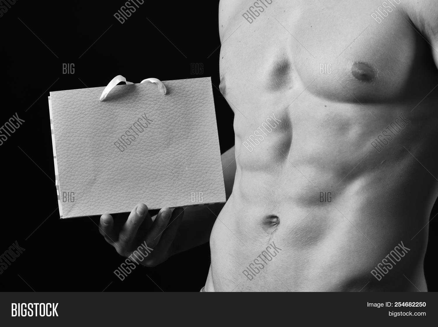 ab,athlete,athletic,background,bag,black,body,bodybuilding,caucasian,chest,close,concept,exercise,fit,fitness,guy,hand,health,healthcare,healthy,hold,hot,isolated,lifestyle,macho,male,man,model,muscle,muscular,naked,package,packet,perfect,pink,present,sex,sexy,shopping,slim,sport,strength,strong,textured,torso,up